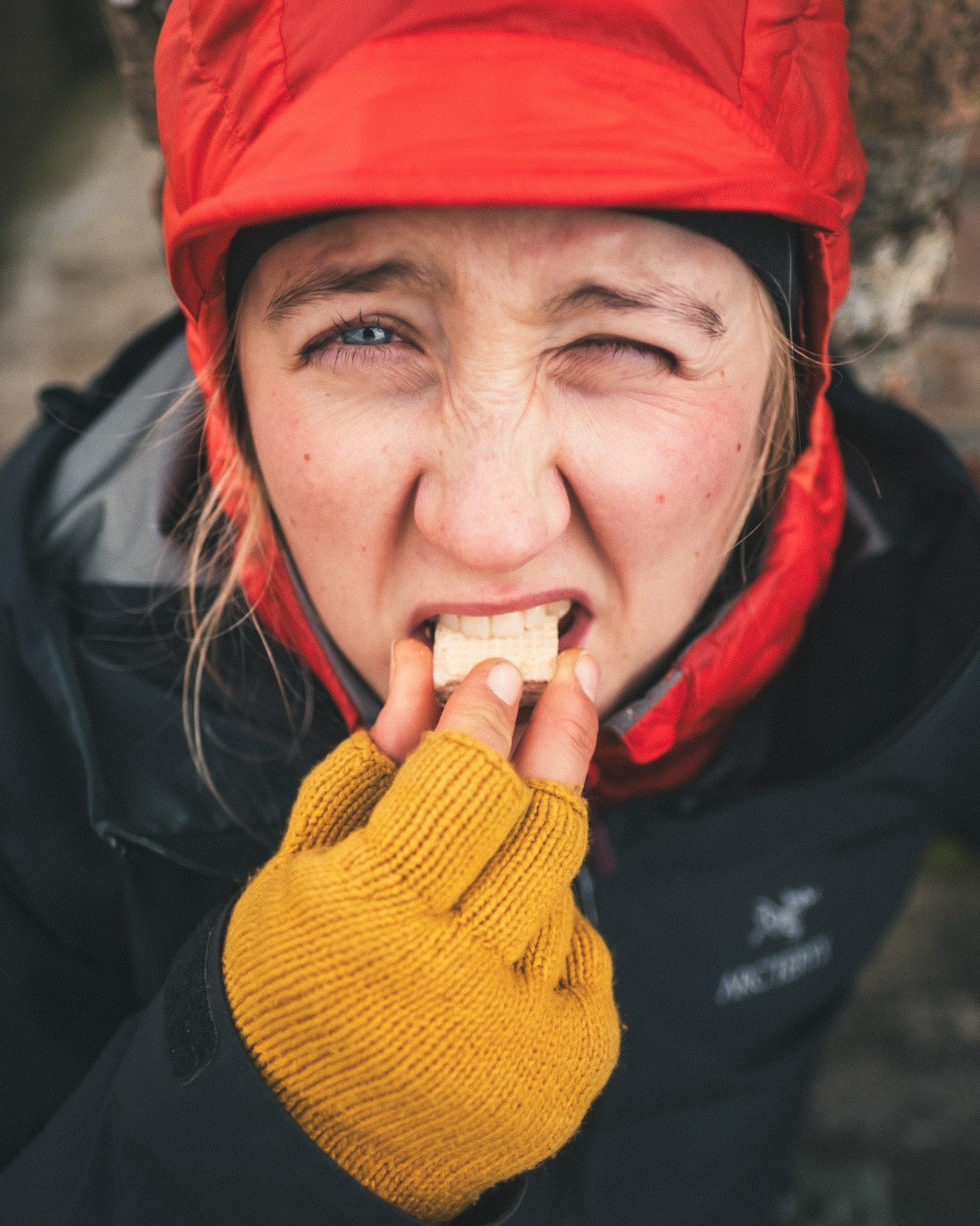 Woman eating camping food in the winter