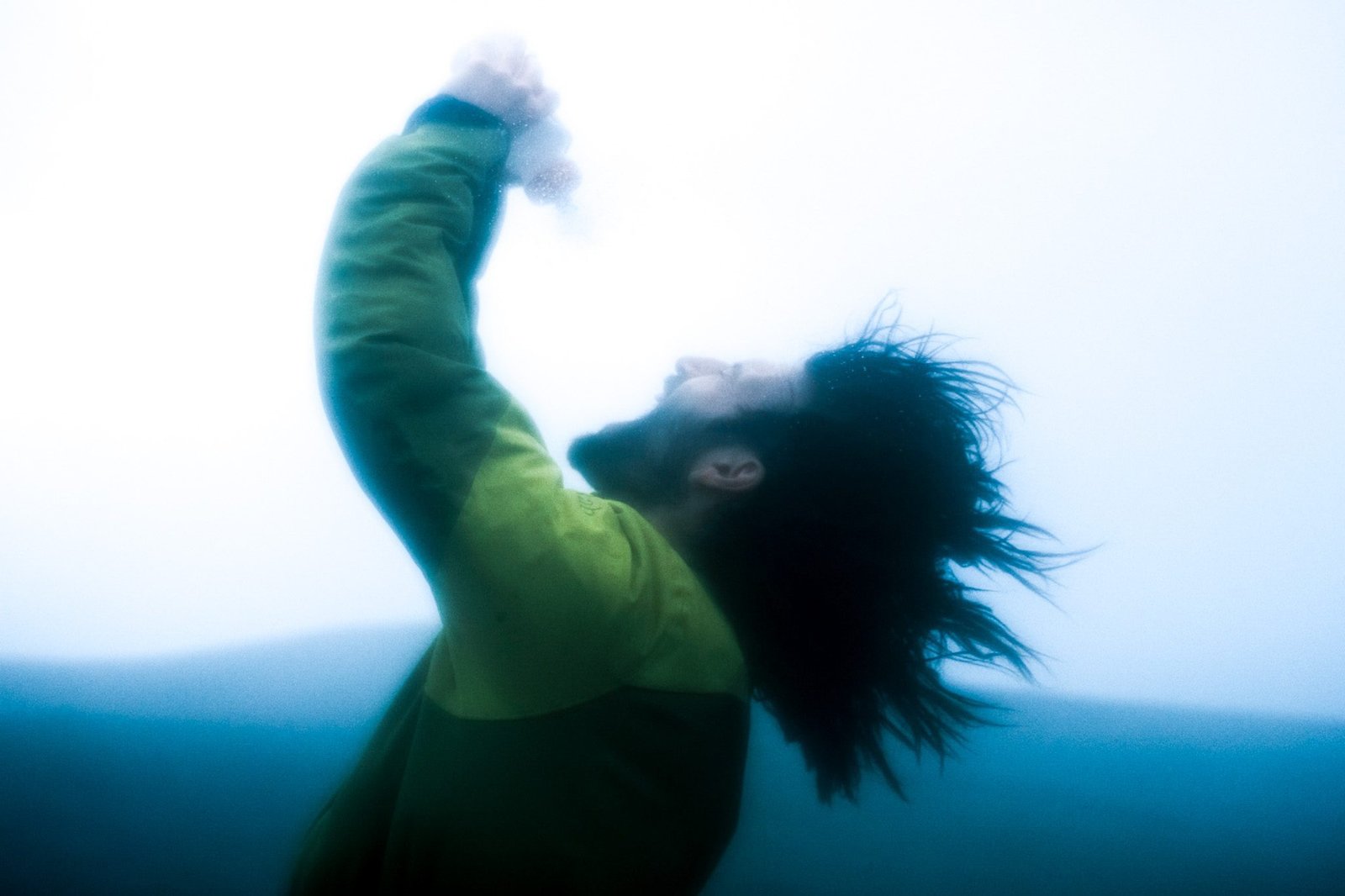 Wild man drinking water in the mountains - outdoors