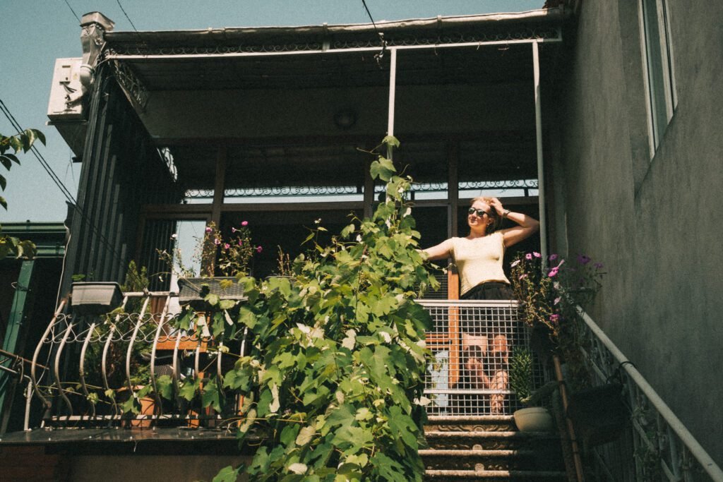 Woman growing vegetables on balcony